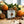 Soap bar from Potager Soap Co. with holiday spices and fruits on a wooden surface