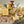 An assortment of Potager natural soap bars with slight visual imperfections, displayed on a surface with scattered dried flowers and botanicals.